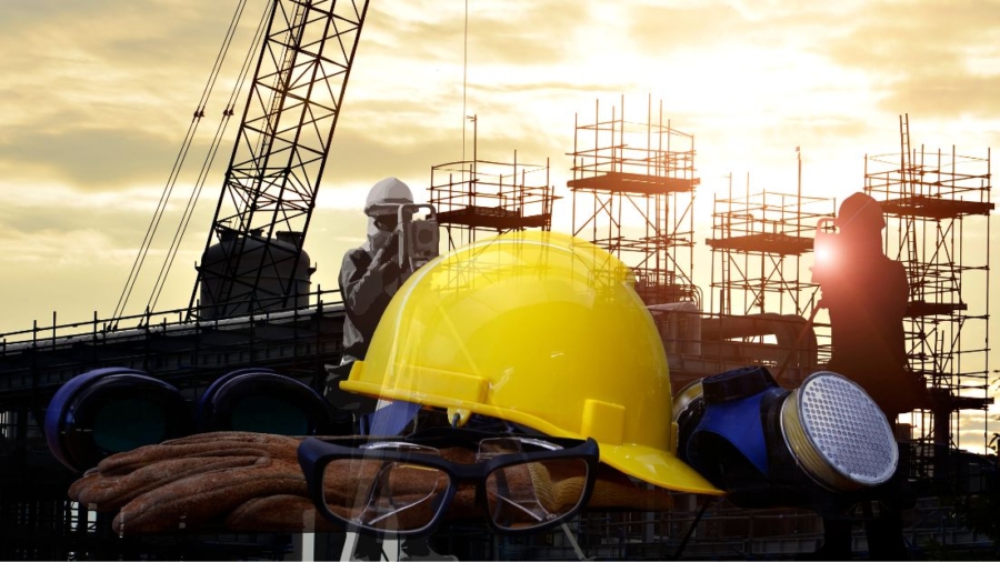 A construction worker wearing safety equipment for construction sites, including a helmet and goggles
