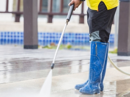 A jet cleaning service in action, clearing a blocked drainage system with high-pressure water jets